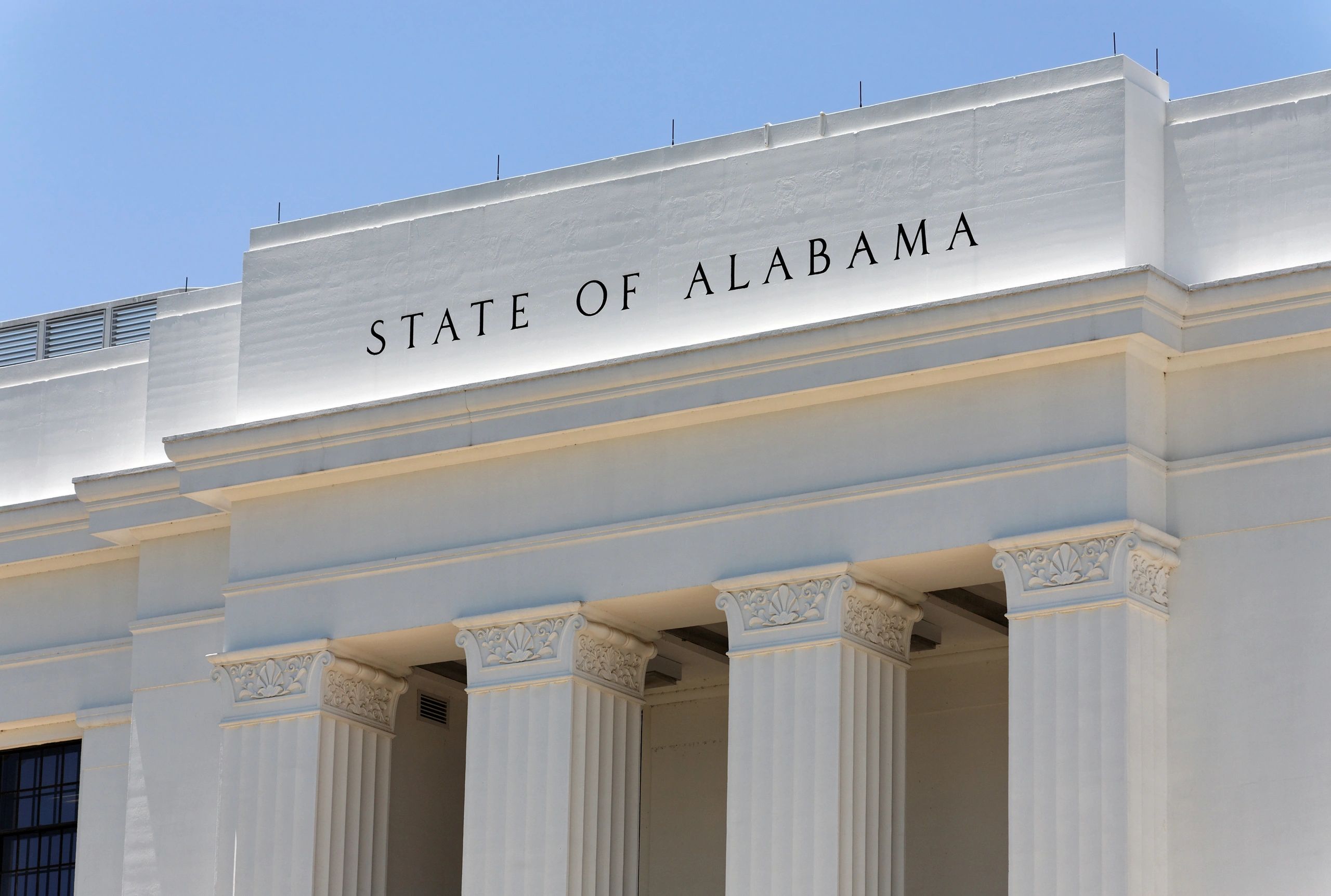 Entrance of a government building labeled State of Alabama.